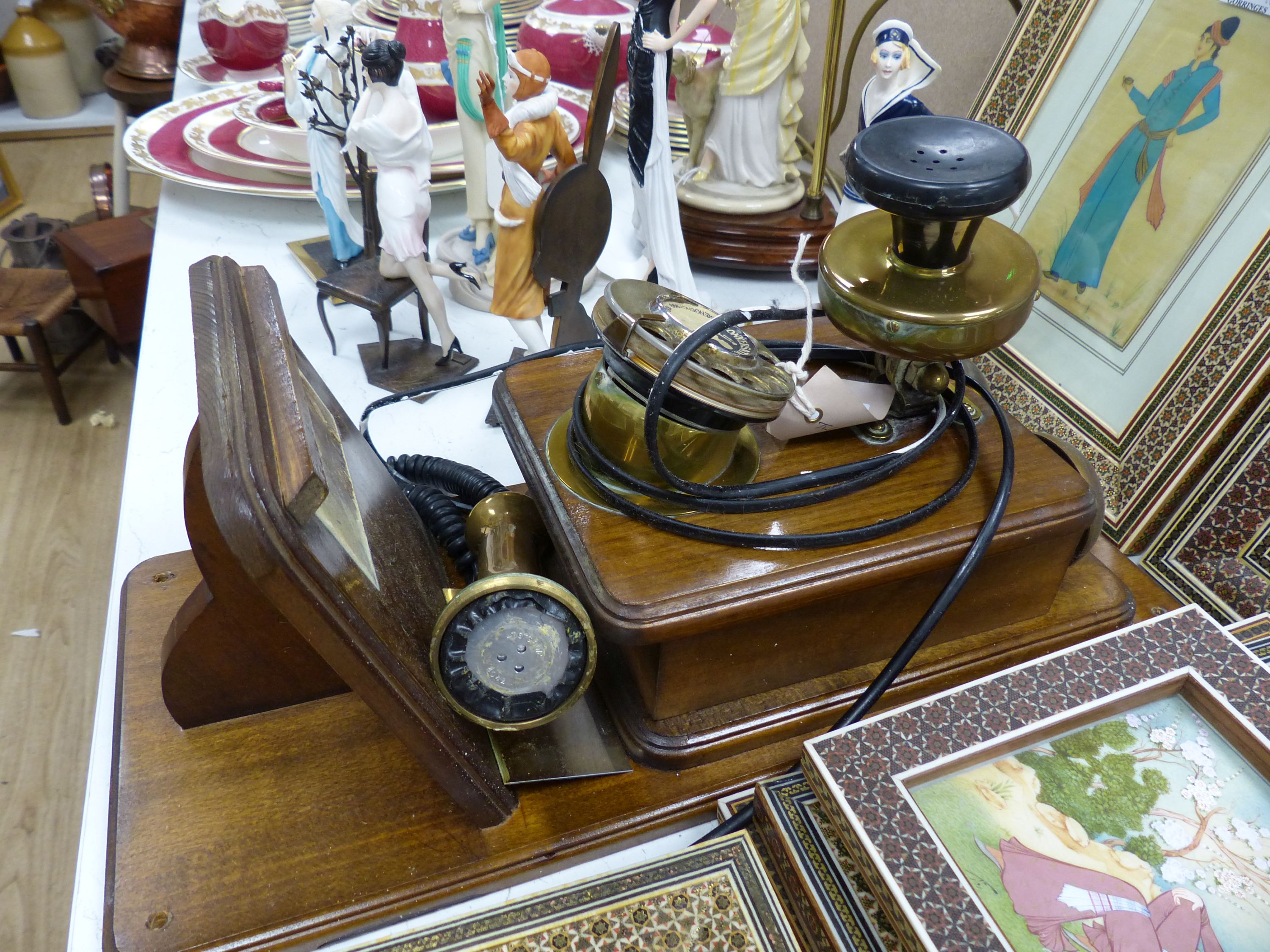 A vintage wood, brass and Bakelite wall-mounted telephone